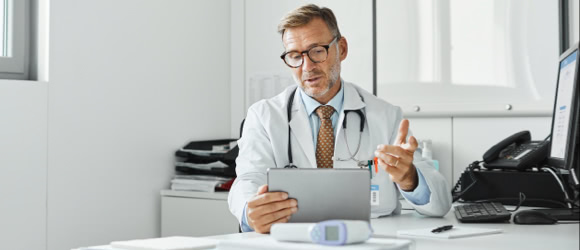 doctor talking to a patient on his ipad