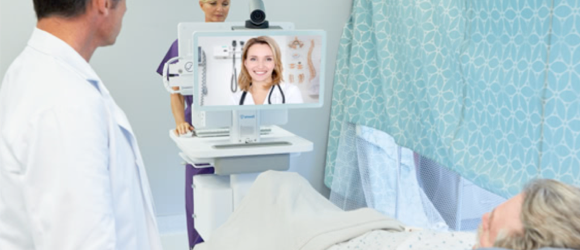 patient in a hospital talking to a specialist via cart