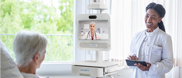 Provider talking to a patient in a hospital